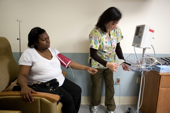 Bariatric patient being examined by nurse prior to operation